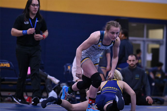 Texas Wesleyan Wrestler Lexie Basham celebrating in the Sid Richardson Center after a win over an opponent