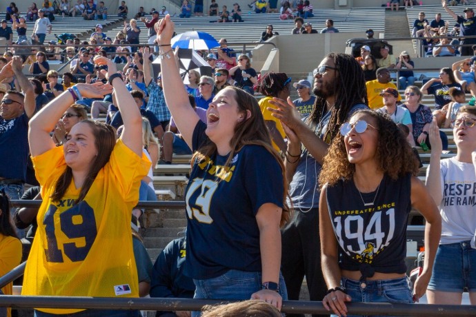 Photo of fans cheering during 2019 homecoming football game