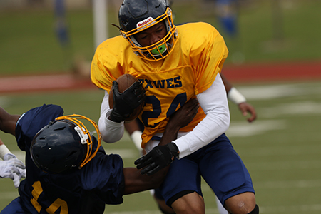 Running back Montreveus Jackson breaks a tackle at the Blue & Gold Game.