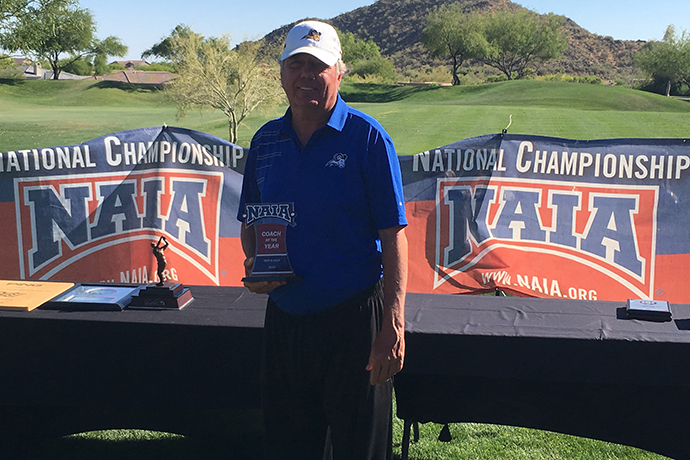 Photo of TXWES men's golf Head Coach Bobby Cornett with his 2019 Coach of the Year trophy.