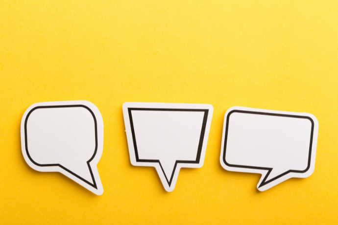 Speech Bubbles atop a yellow gradient background