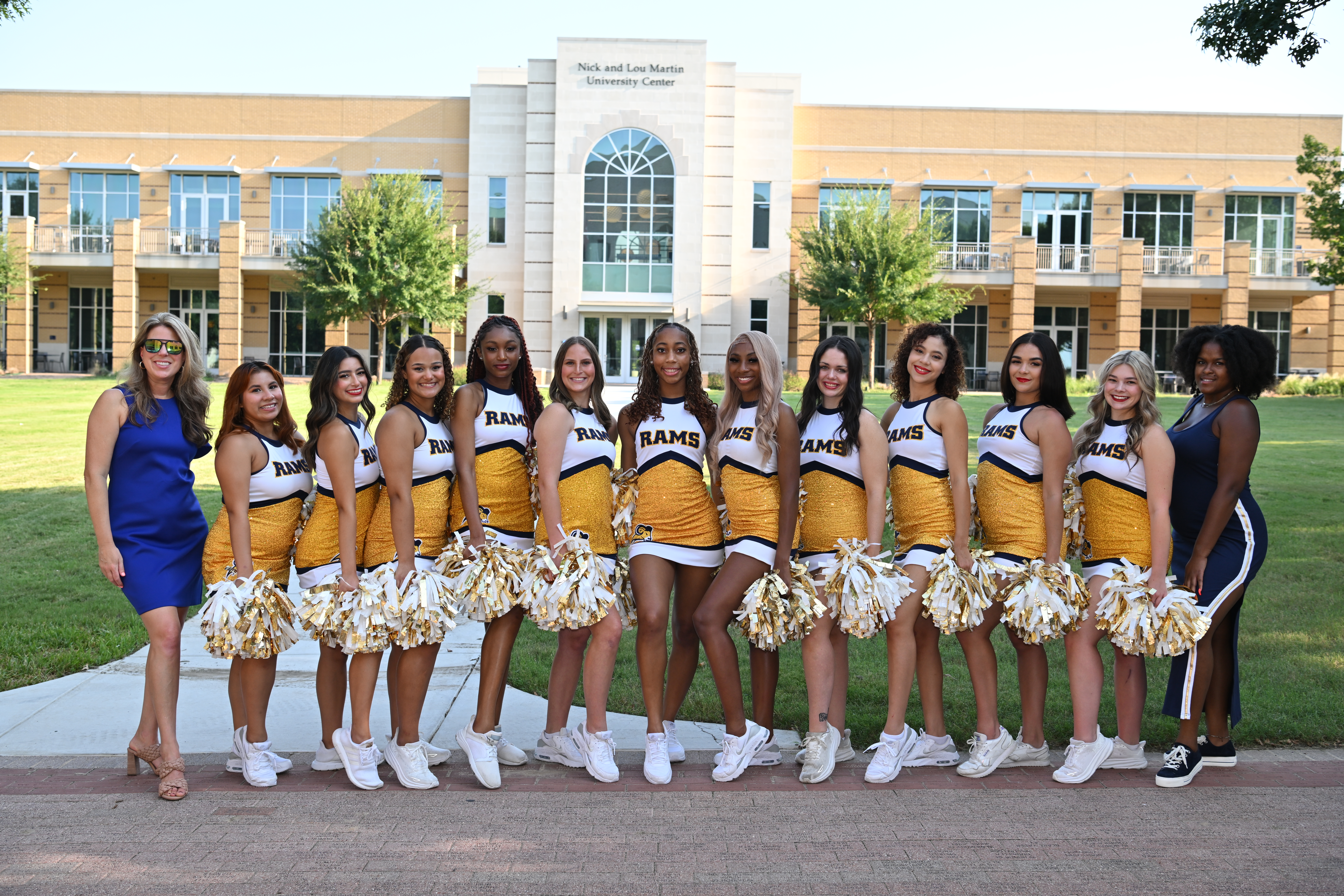 The Gold Line Dancers and Coaches Pose on Campus