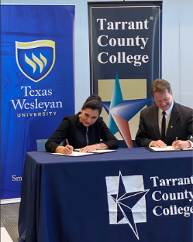 Photo of Texas Wesleyan President Fred Slabach and TCC Provost Elva LeBlanc signing a MOU on the new TCC to TXWES Pathway.