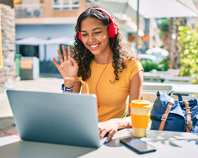Girl Having a video conference on lap top while outside