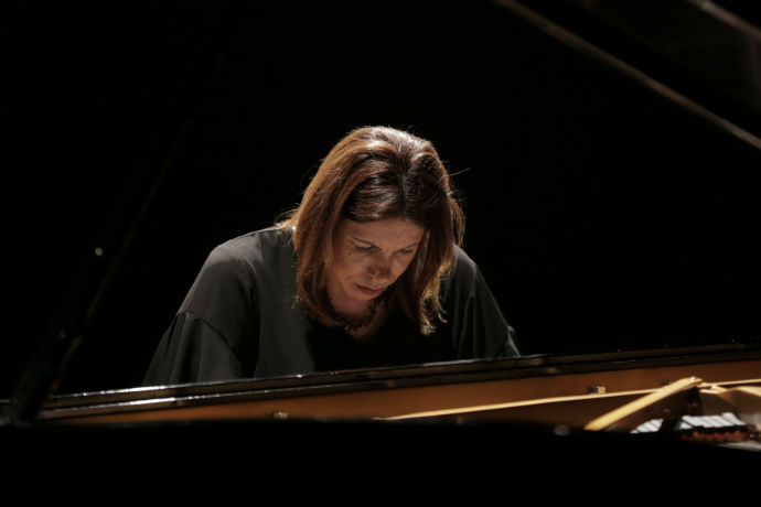 Photo of TXWES music professor Ilka Araujo performing a piano recital in Brazil