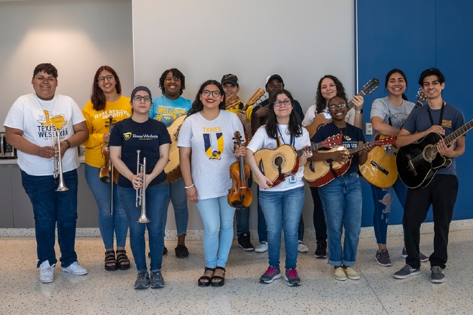Mariachi Oro Azul Students pose with their instruments