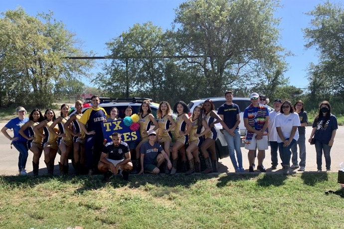A group of Texas Wesleyan students and faculty at the 2022 Fort Worth Fiestas Patrias Parade