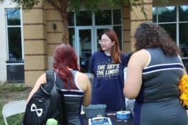 student informing other students about organization and how to join