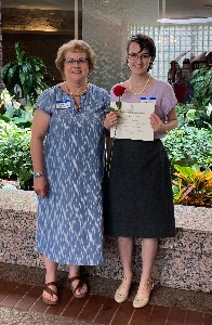 Professor and Student with award