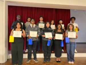 Group of students standing with certificates