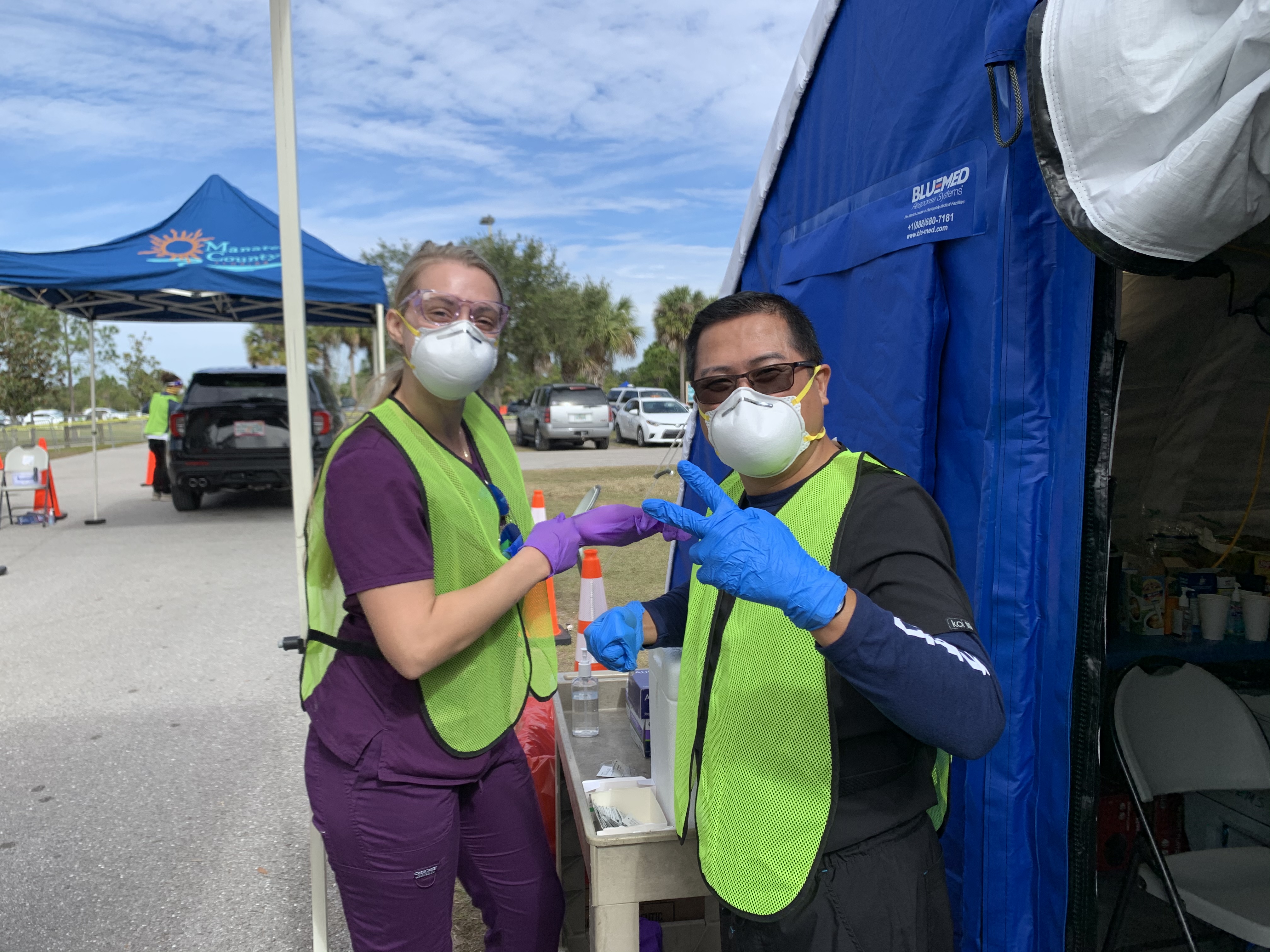 Dr. Jose Castillo poses with colleague during COVID-19 vaccination clinic