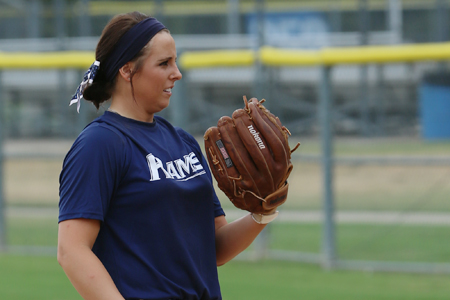 student pitching in softball game
