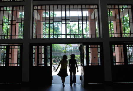 students leaving an academic building
