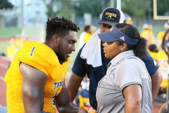 Photo of football Athletic Trainer Dominique Brown during a TXWES football game.
