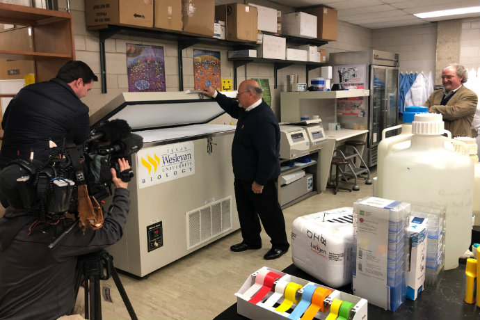 Photo of Dean Ricardo Rodriguez and Prof. Bruce Benz as they show WFAA one of two ultra-low bio freezers