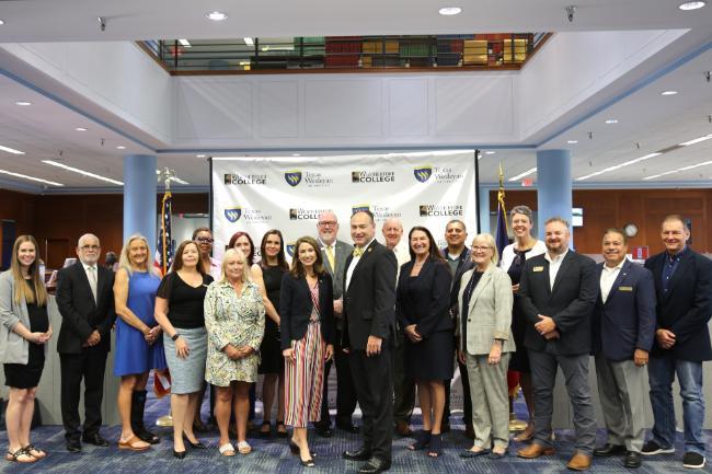 Group of people pose at the MOA signing