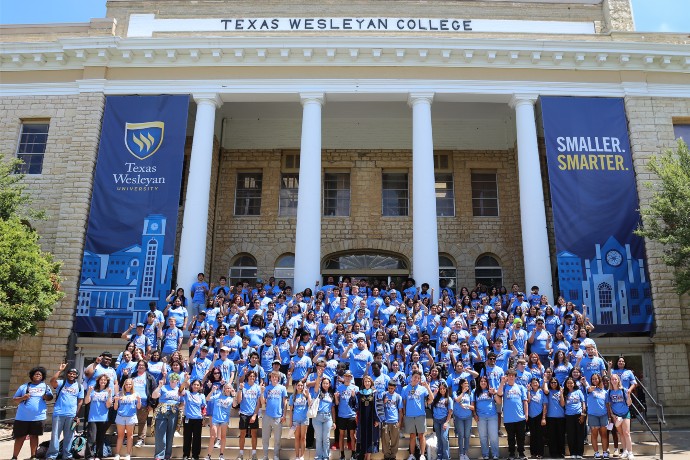 First-Year Students Pose on the steps of the administration building