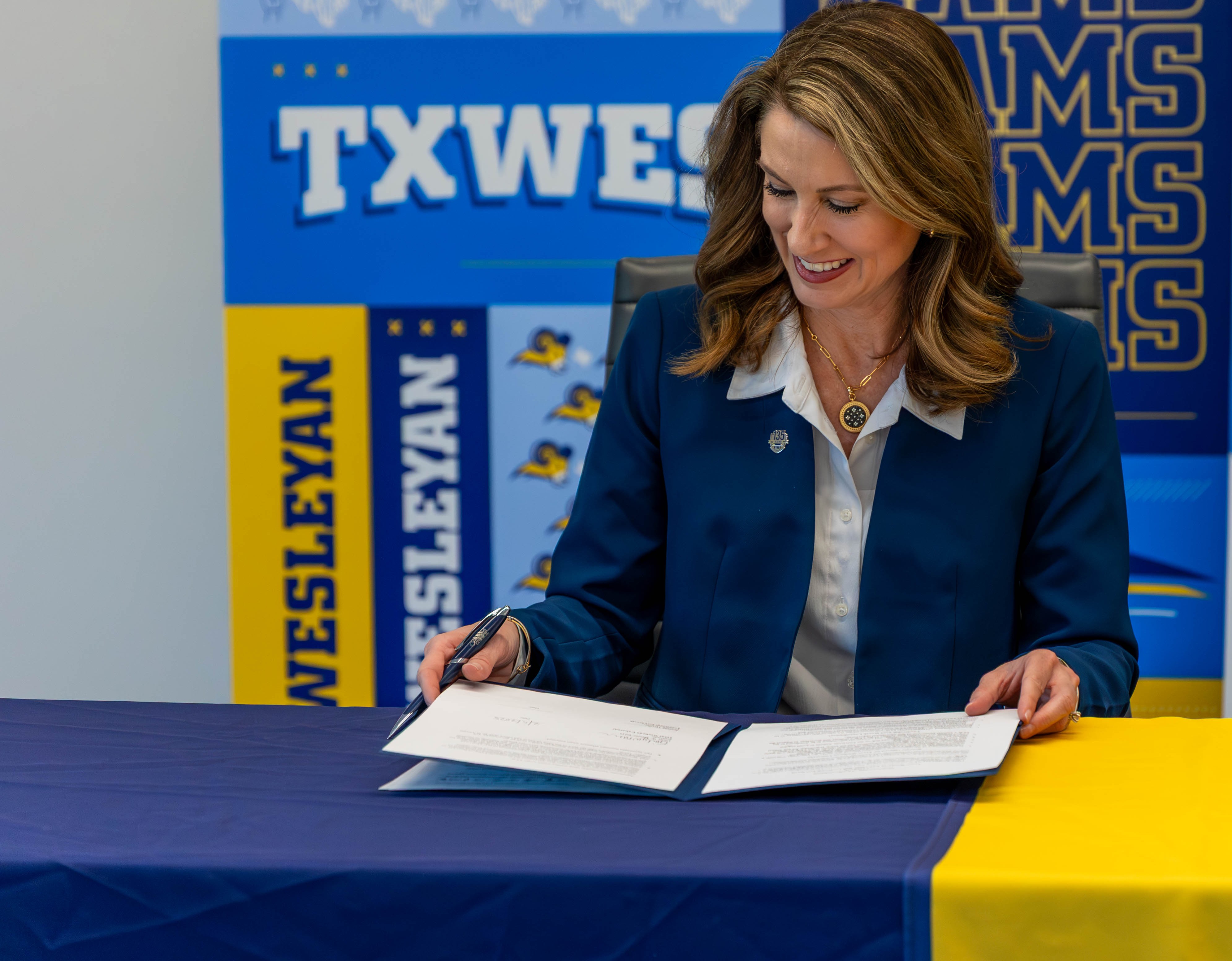 Dr. Messer signing MOU with Dallas