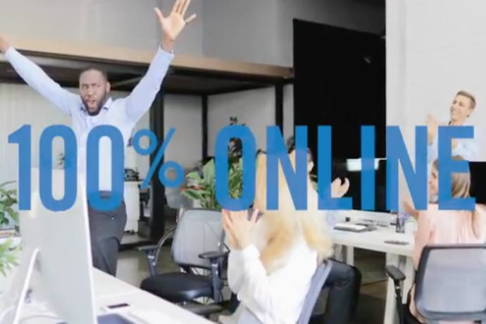 Screenshot from 2018 online MBA commercial. Man is seen dancing along side his applauding co-workers.