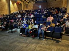 Students in SLT watching the debate.