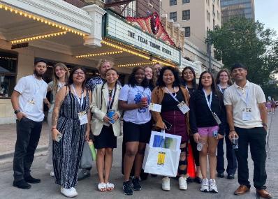 Students posing in front of the Paramount Theater