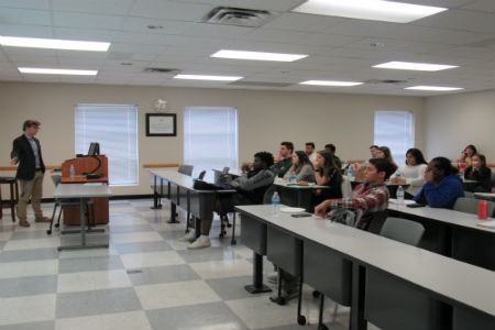 Accounting Society Guest Speaker Nikolaj Brons-Piche talking in front of students in a classroom