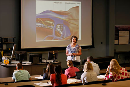 Assistant Professor of Nurse Anesthesia Terri Kane lecturing over the cardiovascular system.