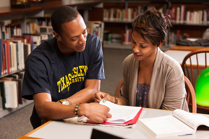 Students study together in the West Library.