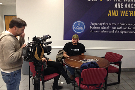 Texas Wesleyan University senior business major interviews with WFAA about project he completed with RadioShack.