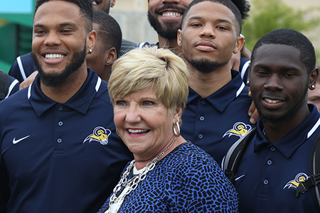 Mayor Price greets the Texas Wesleyan basketball team at the Rosedale Renaissance Dedication Ceremony October 2015.