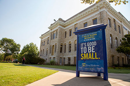A sign in front of the Oneal-Sells Administration building proudly announces that Texas Wesleyan has been ranked in the top tier of regional universities in the West by U.S. News and World Report for the sixth consecutive year.